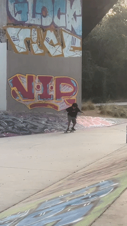Skating and hanging at a graffiti-covered underbridge skatepark in L'Hospitalet