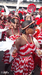 Children in green-white costumes gather on Lagos street