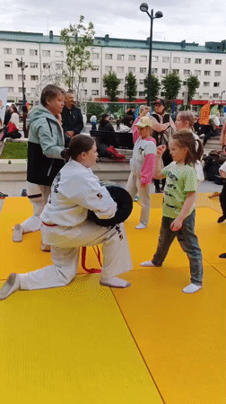 Girl practices karate and trampolines in rainy Syktyvkar