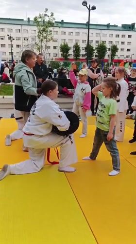 Girl practices karate and trampolines in rainy Syktyvkar