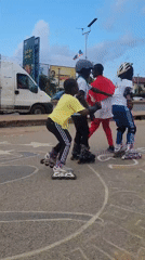 Children practice roller skating on Jos street