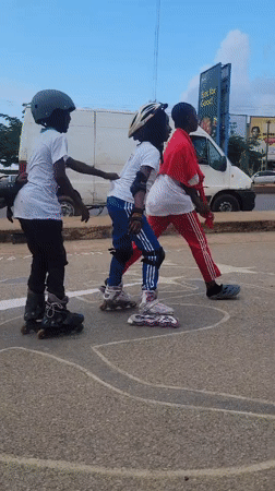 Children practice roller skating on Jos street