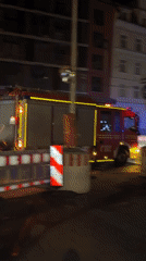 Fire engine navigates Munich construction zone at night