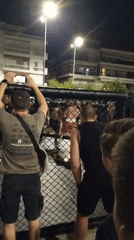 Outdoor MMA bout draws a crowd in Perea, Greece