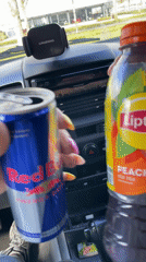 Driver holds energy drink and iced tea in Dronten