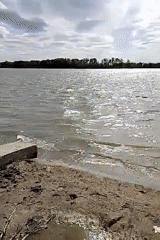 Concrete block observed on sandy shore in Pavlodar