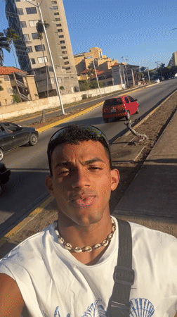 Young man films selfie video on Porlamar streets