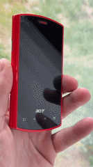 Person holds red Acer phone in Chuprino, Russia