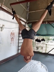 Inverted ankle hang at a Nha Trang outdoor gym