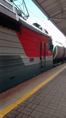 Quiet morning at Trudovoye station, RZD freight train passing through