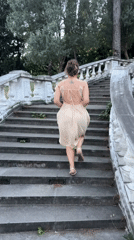 Woman in dress explores scenic Podgorica locations with child