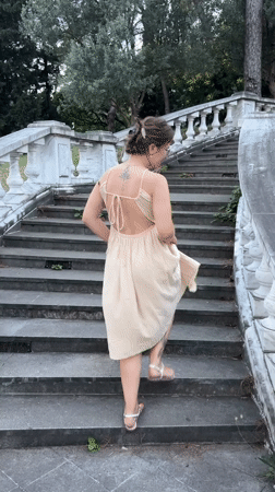 Woman in dress explores scenic Podgorica locations with child