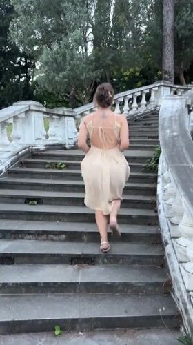 Woman in dress explores scenic Podgorica locations with child