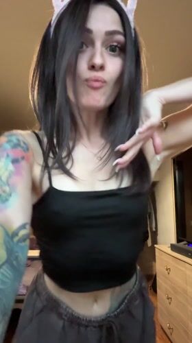 Woman records playful selfie videos with cat ears