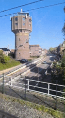 Train passenger films brick water tower in Alkmaar
