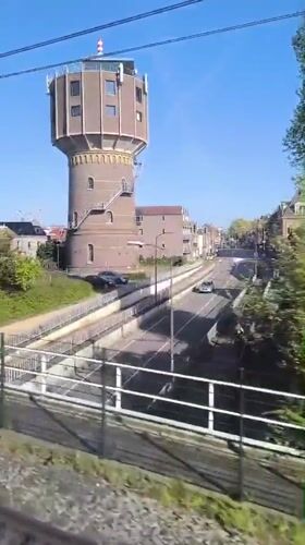 Train passenger films brick water tower in Alkmaar