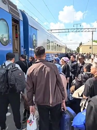 Morning train boarding and street scenes captured in Shymkent