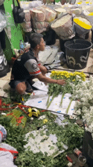West Jakarta flower market, bouquets assembled among colorful stalls