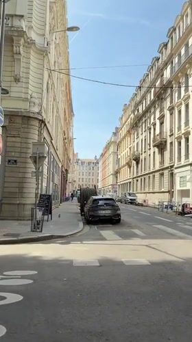 Street scenes captured in Lyon showing architecture, man on balcony
