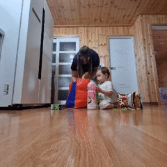 Quiet domestic scene in a wood-paneled home, Dunnae-myeon
