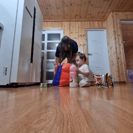 Quiet domestic scene in a wood-paneled home, Dunnae-myeon