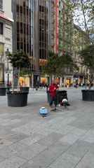 Street musician performs with maracas in Barcelona square