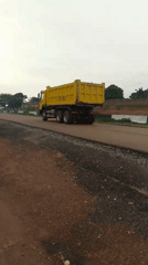 Road construction underway in Keffi, Nigeria with heavy machinery