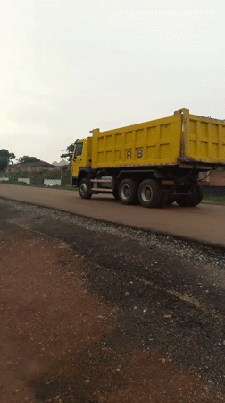 Road construction underway in Keffi, Nigeria with heavy machinery