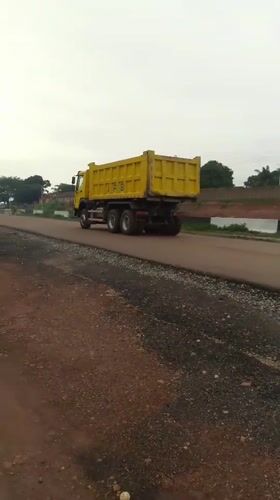 Road construction underway in Keffi, Nigeria with heavy machinery