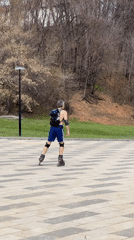 Man rollerblades in Cheboksary park wearing protective gear