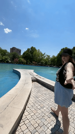 Woman in leopard print visits Yerevan park fountain