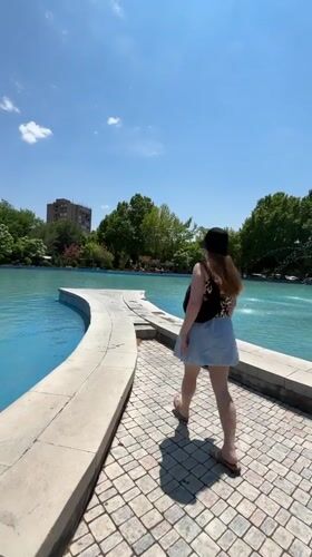 Woman in leopard print visits Yerevan park fountain