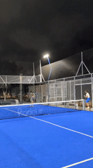 Nighttime padel on a floodlit outdoor court in Ramat Gan