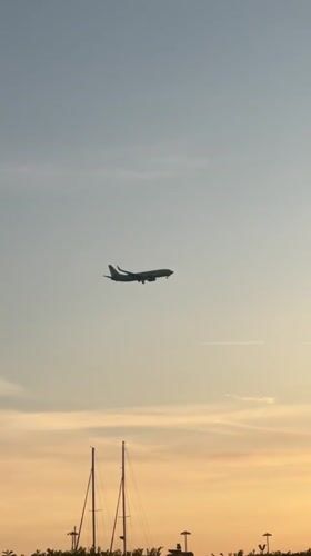 Aircraft lands at dusk in coastal Sirius, Russia