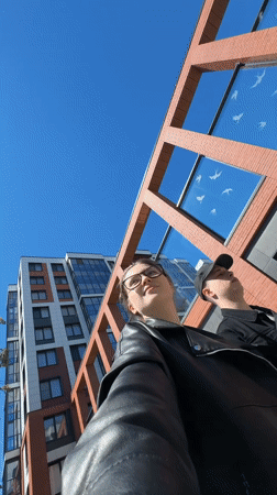 Modern red brick apartment complex explored across Saint Petersburg streets
