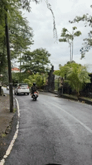 Evening traffic captured on wet road in North Kuta