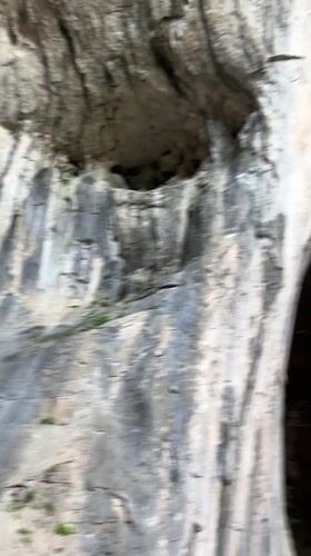 Visitors explore Devetashka cave formations in Karlukovo, Bulgaria