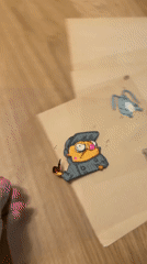 Cartoon detective character drawn on transparent sheet in Moscow