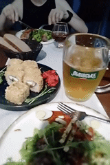 Sushi and beer at a warmly lit Dnipro restaurant