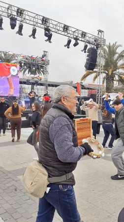 Live music and dancing at an outdoor festival in Puente Alto