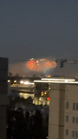 Fireworks over Saint Petersburg, scooters staged nearby