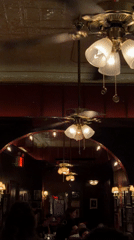 Interior view of ornate restaurant with spinning ceiling fans
