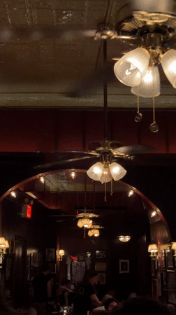 Interior view of ornate restaurant with spinning ceiling fans