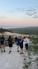 Group walks hillside paths in Khvalynsk during afternoon outing