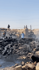 Firefighters Battle Large Tire Fire in Kandahar