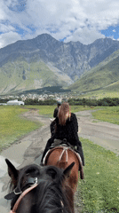 Horseback riding on a mountain trail near Stepantsminda, Georgia