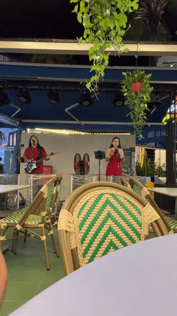 Outdoor night concert on a lit stage in Jiyang District