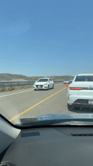 Clear afternoon drive through Santiago Atzitzihuacán highway captured