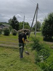 Spring yard work and garden blooms in Russian village