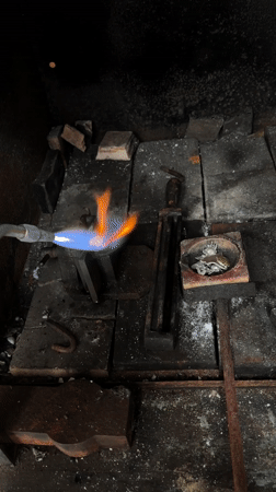 Metalworking with torch observed in Cordoba workspace